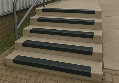 Close-up of heavy duty stair nosing installed on industrial steps for safety