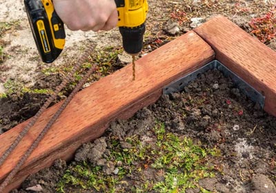 Wooden timber edging compared with metal edging for flooring and landscaping